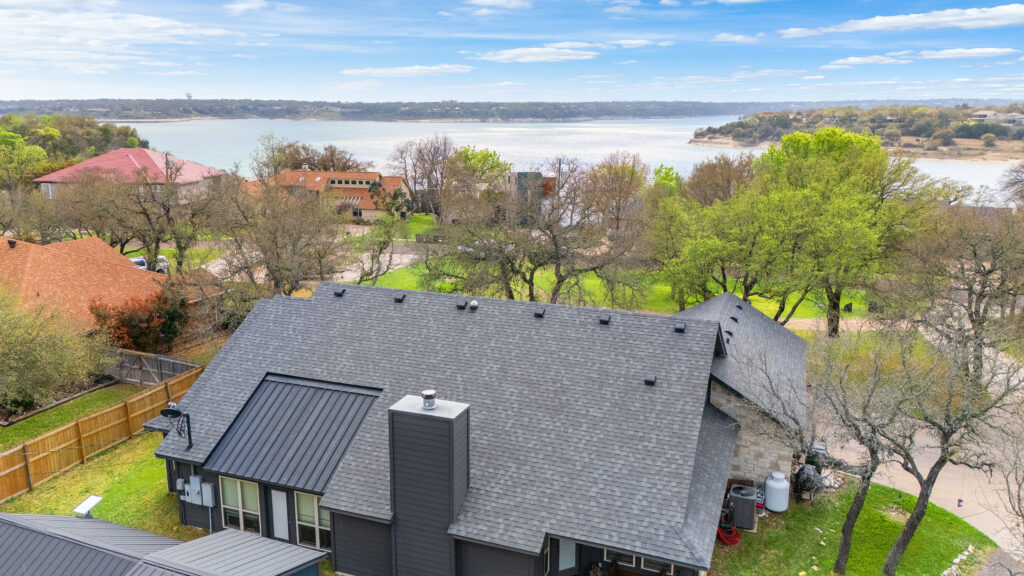 Aerial drone photograph of a residential home overlooking Lake Travis in Central Texas