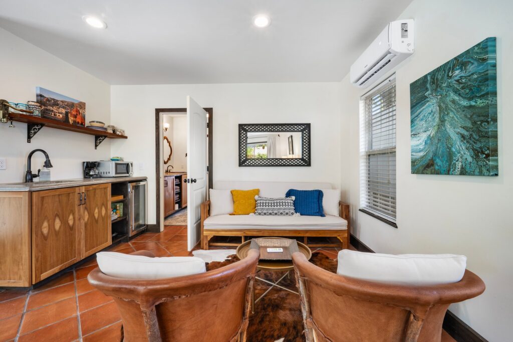 Austin real estate photography featuring a bright, modern living room with elegant furnishings, natural light, and professionally captured interior photography.