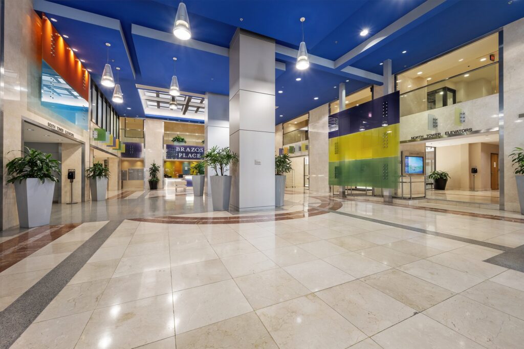 Austin downtown real estate photography featuring a modern condominium lobby with luxury finishes, elegant design, and professional interior photography.
