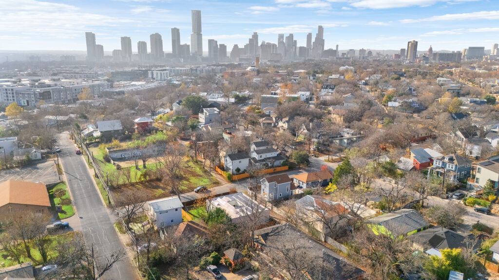 Austin drone aerial real estate photography showcasing the downtown Austin skyline with luxury properties, city views, and professional FAA-certified drone photography.