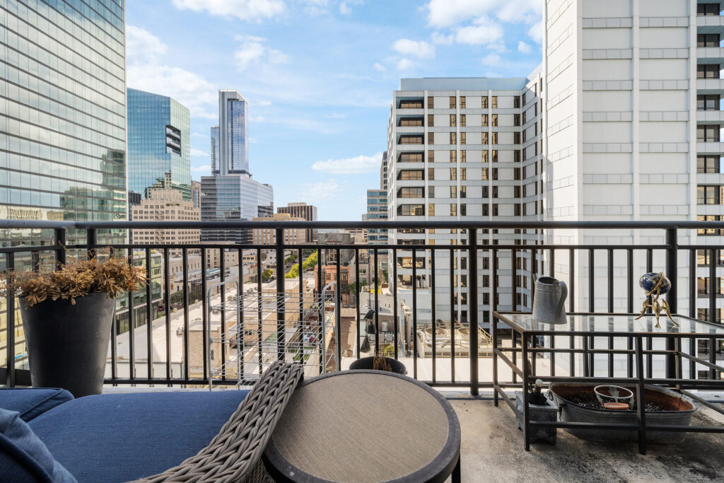 Austin real estate photographer showcasing a luxury downtown condo balcony with city views, modern outdoor living, and professional real estate photography.