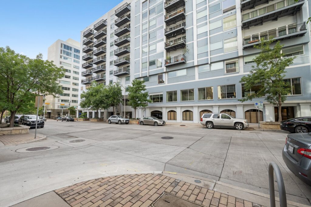 Austin real estate photographer capturing the exterior of a modern downtown condominium building with professional architectural and real estate photography.