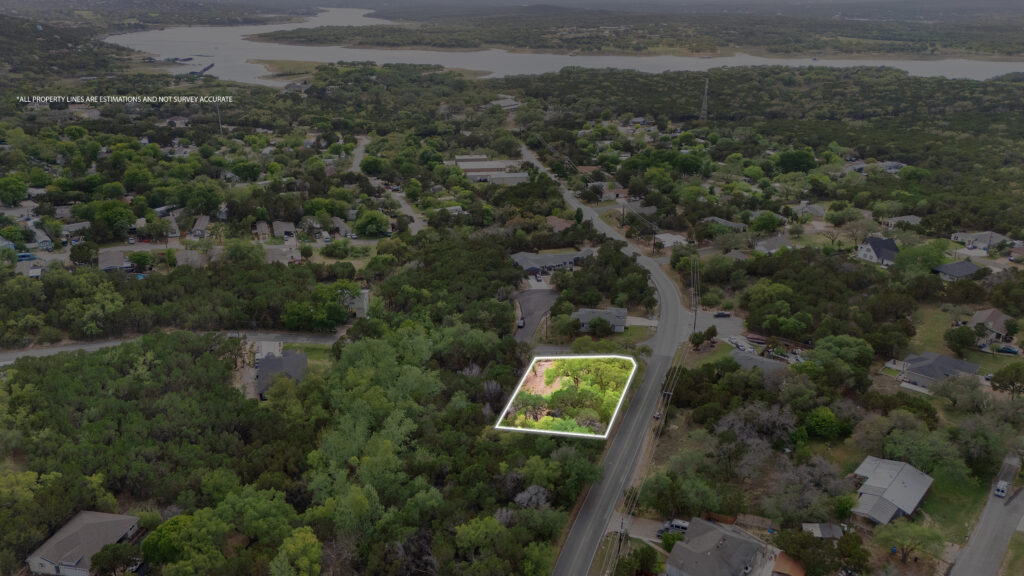 Lago Vista real estate photographer featuring a drone aerial view of a property with outlined boundaries overlooking Lake Travis and the Texas Hill Country.