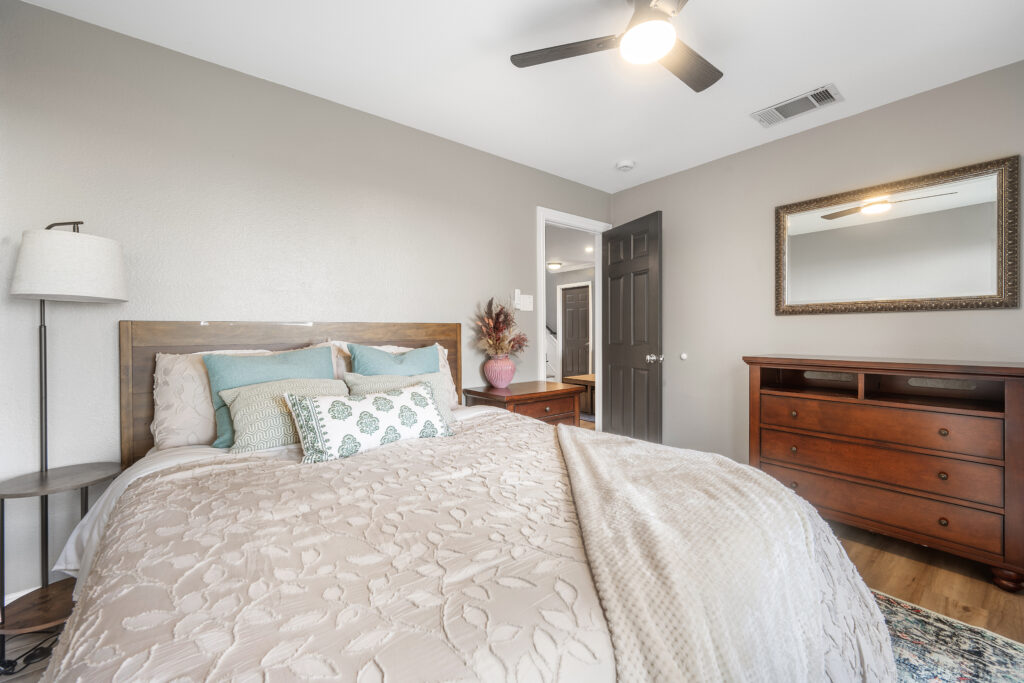 Lago Vista real estate photography featuring a beautifully designed bedroom with abundant natural light, elegant finishes, and professionally captured interior photography.