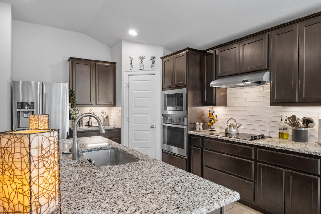 Lago Vista real estate photography featuring a beautifully designed single-family home kitchen with modern finishes, natural light, and professional interior photography.