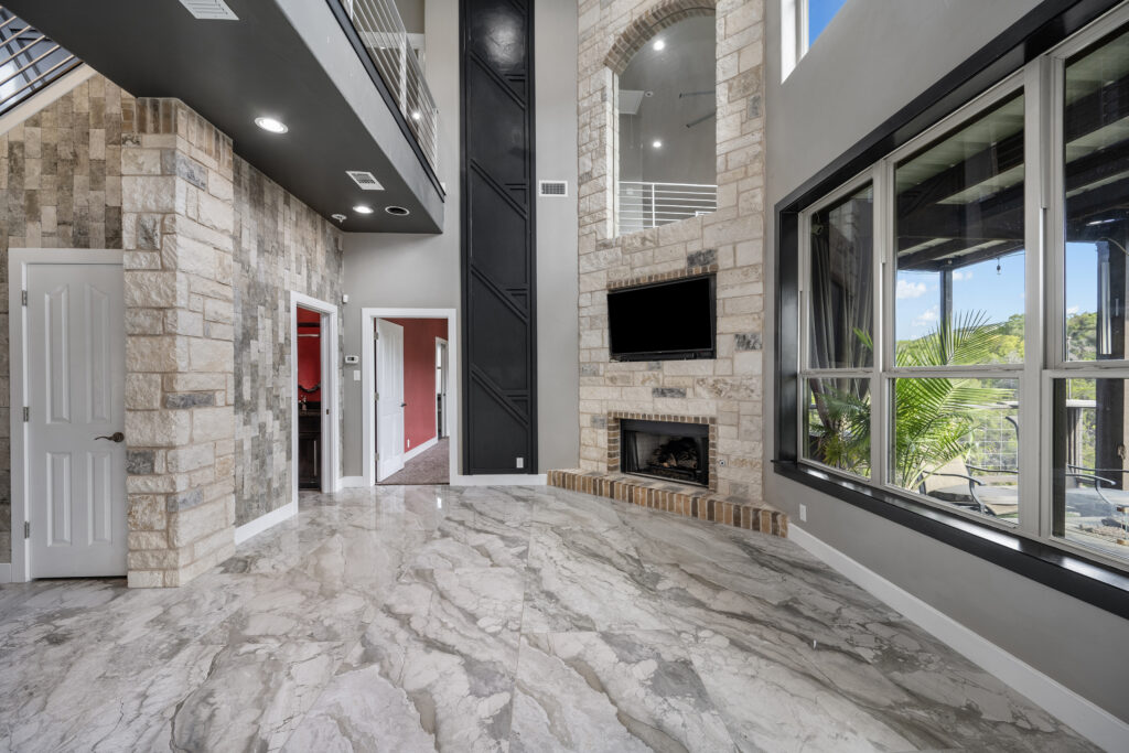 Luxury living room overlooking Lake Travis photographed by ATXPhotoDude, a professional real estate photographer specializing in luxury waterfront homes.