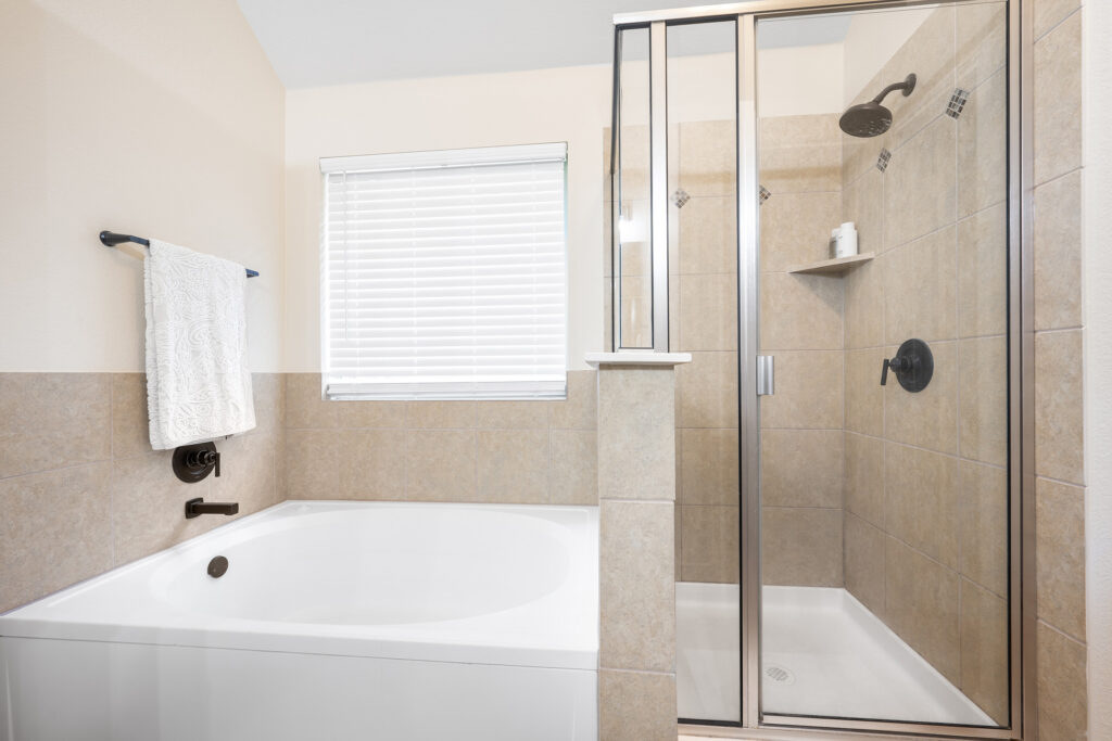 Luxury bathtub and walk-in shower real estate photography in Liberty Hill Texas