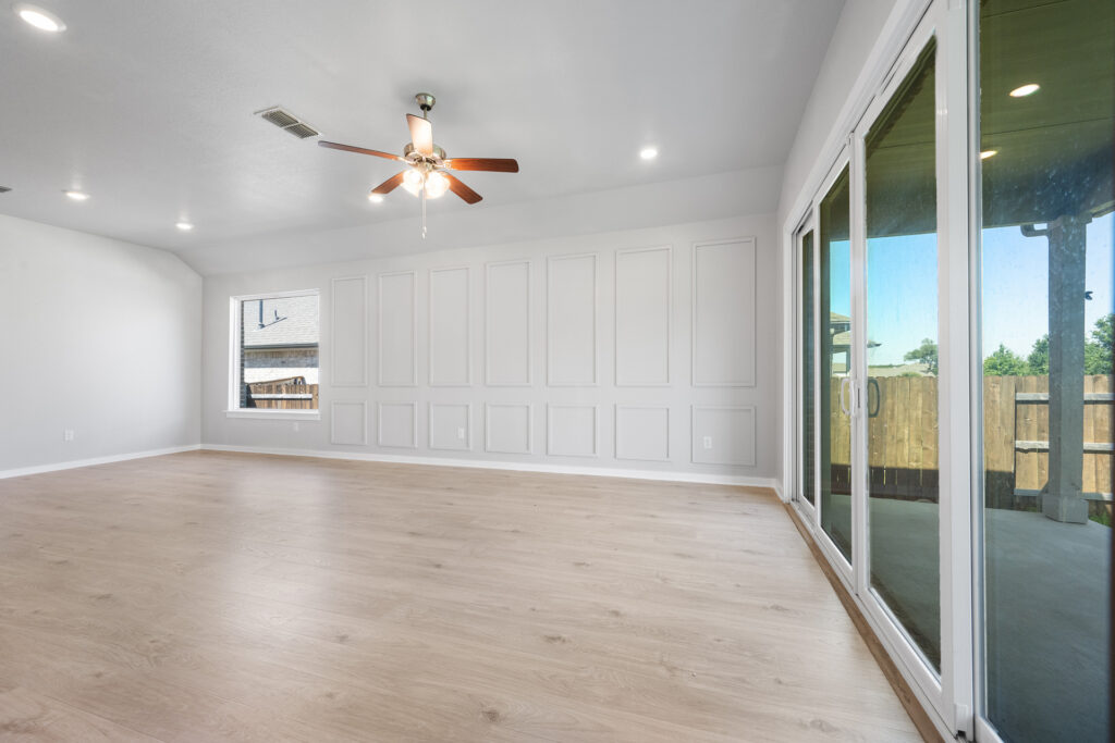 Luxury living room with large windows real estate photography in Liberty Hill Texas
