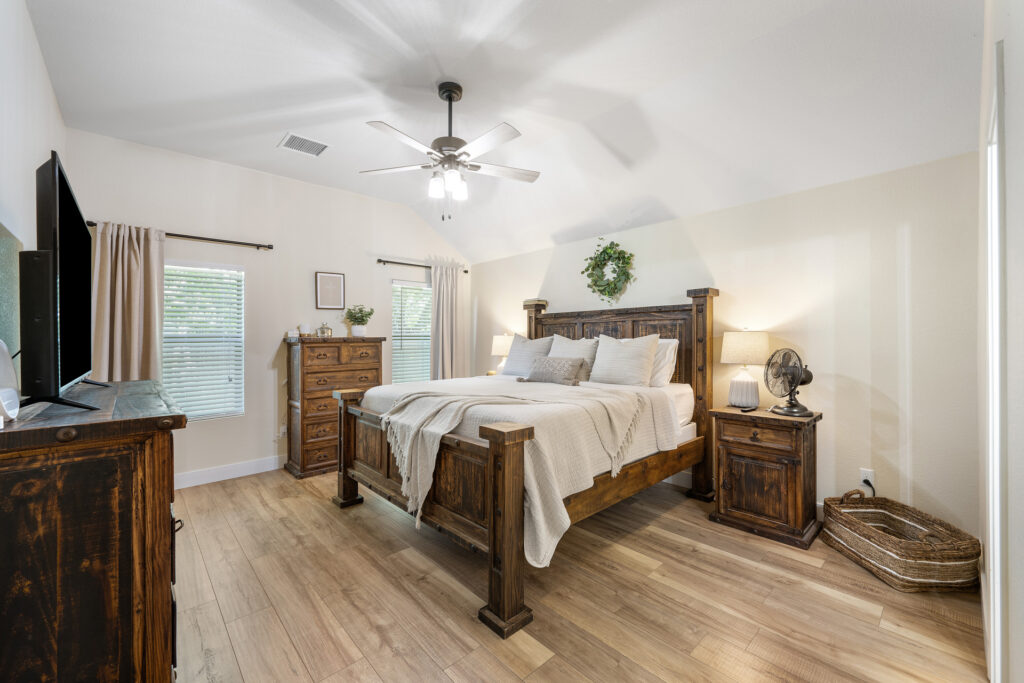 Luxury primary bedroom real estate photography in Liberty Hill Texas