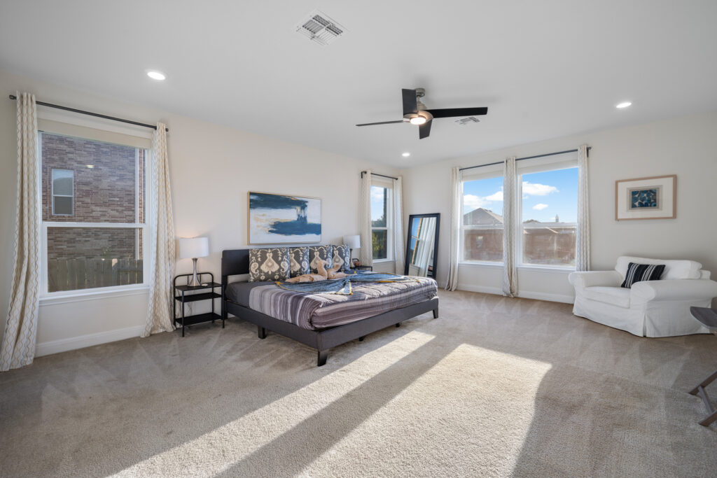 Luxury primary bedroom real estate photography in Round Rock Texas