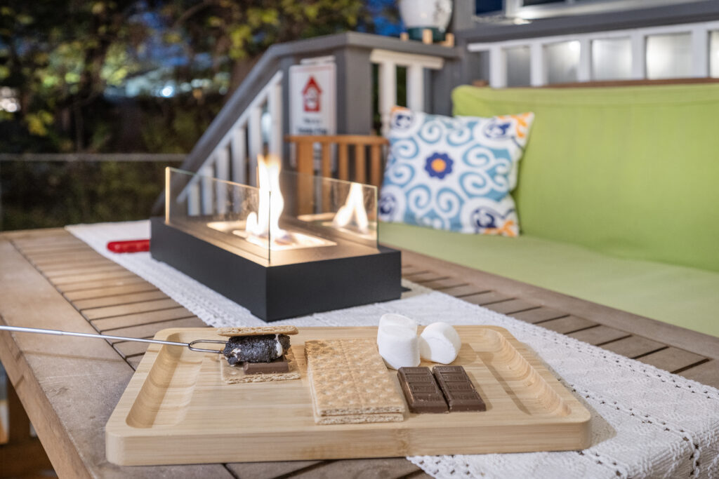 Outdoor s’mores gathering at an Austin Airbnb photographed by ATXPhotoDude, a professional real estate photographer highlighting inviting lifestyle amenities.