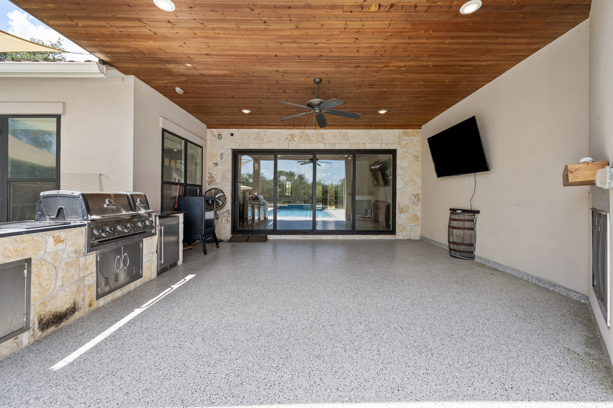 Luxury outdoor kitchen and entertaining area photographed by ATXPhotoDude, a professional real estate photographer specializing in luxury home and outdoor living photography.