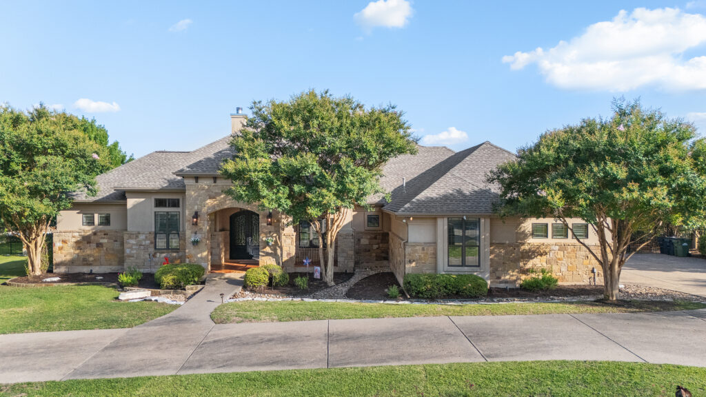 Aerial front exterior of a Georgetown, Texas home photographed by ATXPhotoDude, a professional real estate photographer and FAA-certified drone pilot.